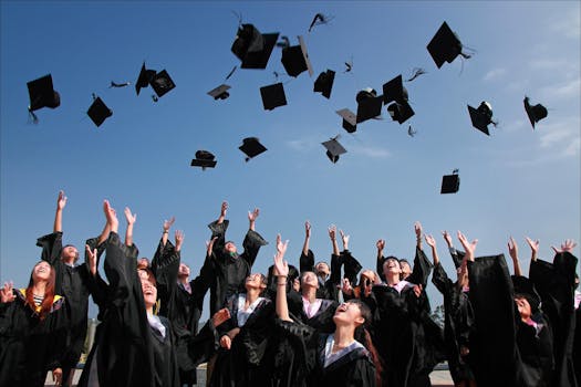 pexels-photo-267885-267885 Group of graduates celebrating by throwing caps in the air during a sunny day.